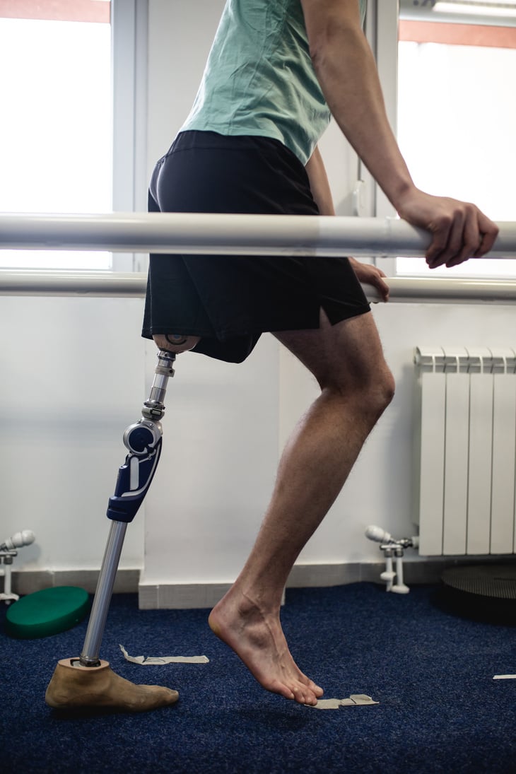 Disabled man at physiotherapy center